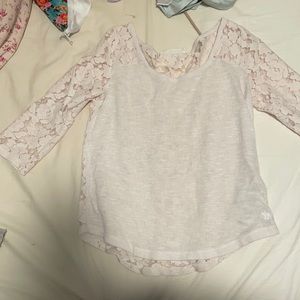 White Abercrombie and fitch shirt. Sleeves are elbow length. Back is laced.